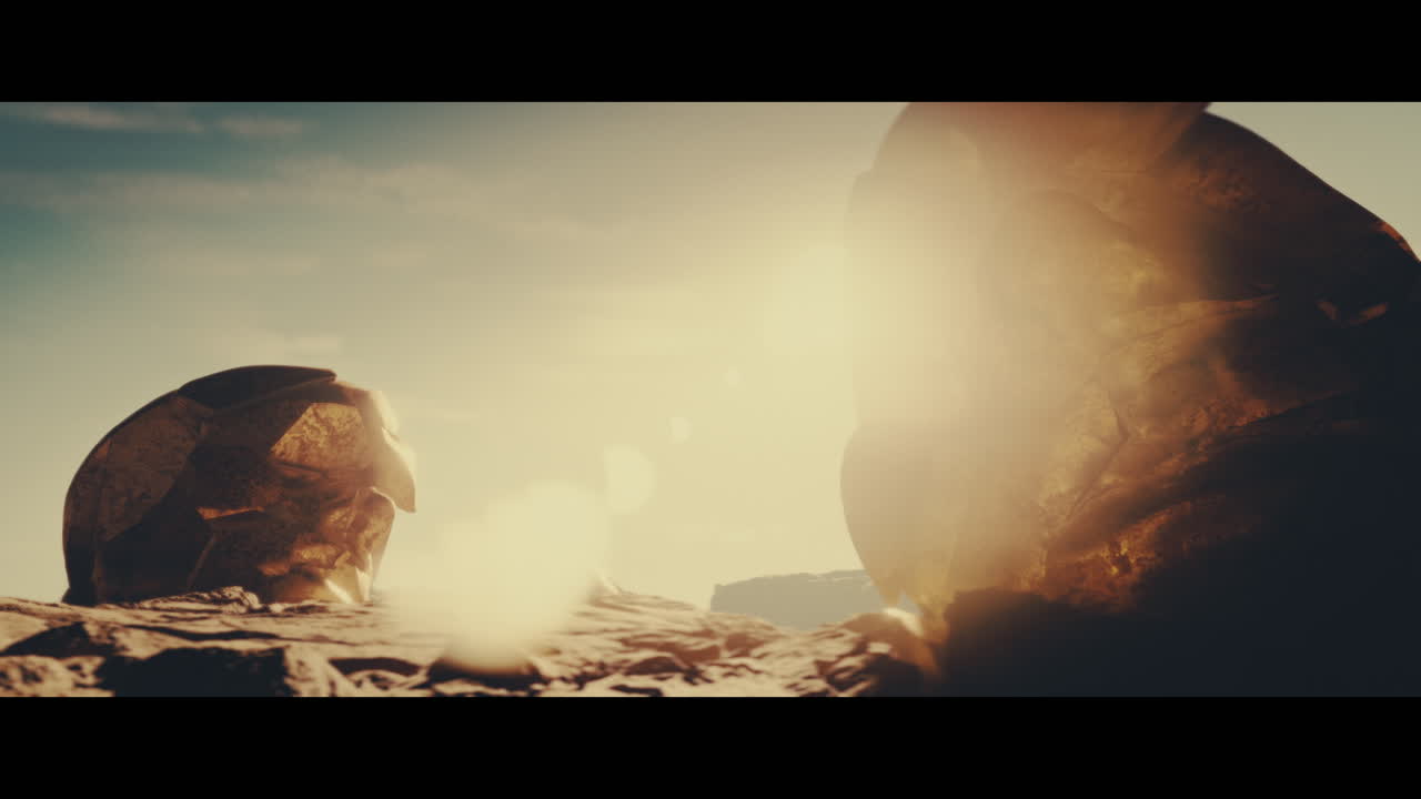 Huge golden statues in the desert during sunset