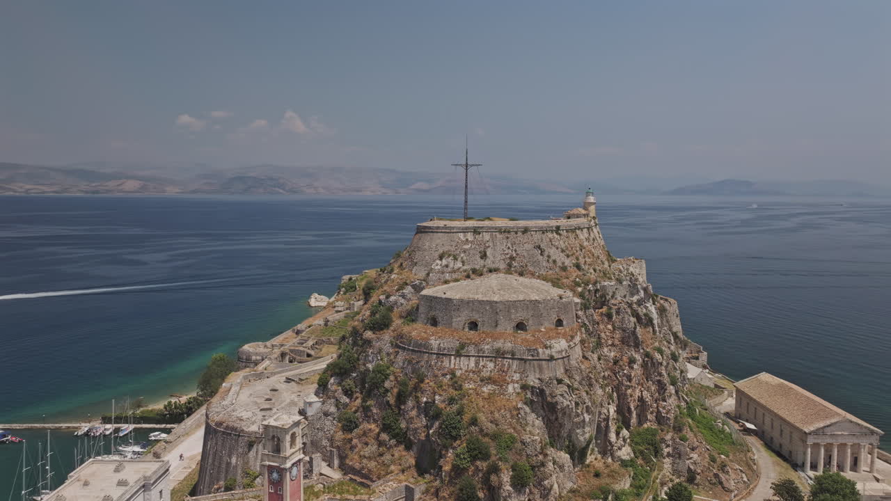 Corfu Greece Aerial v4 circling around the Old Fortress on the promontory capturing views of Garitsa Bay, marina harbor and island town center - Shot with Mavic 3 Pro Cine - July 16th 2024
