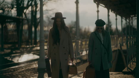 two women walking train station