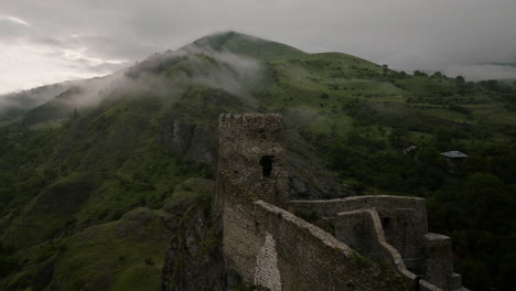 ruins of a defensive wall and a look-out tower overlooking terrian around it