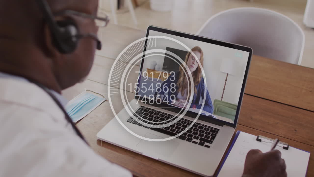 Animation of digital data processing over african american businessman on laptop video call