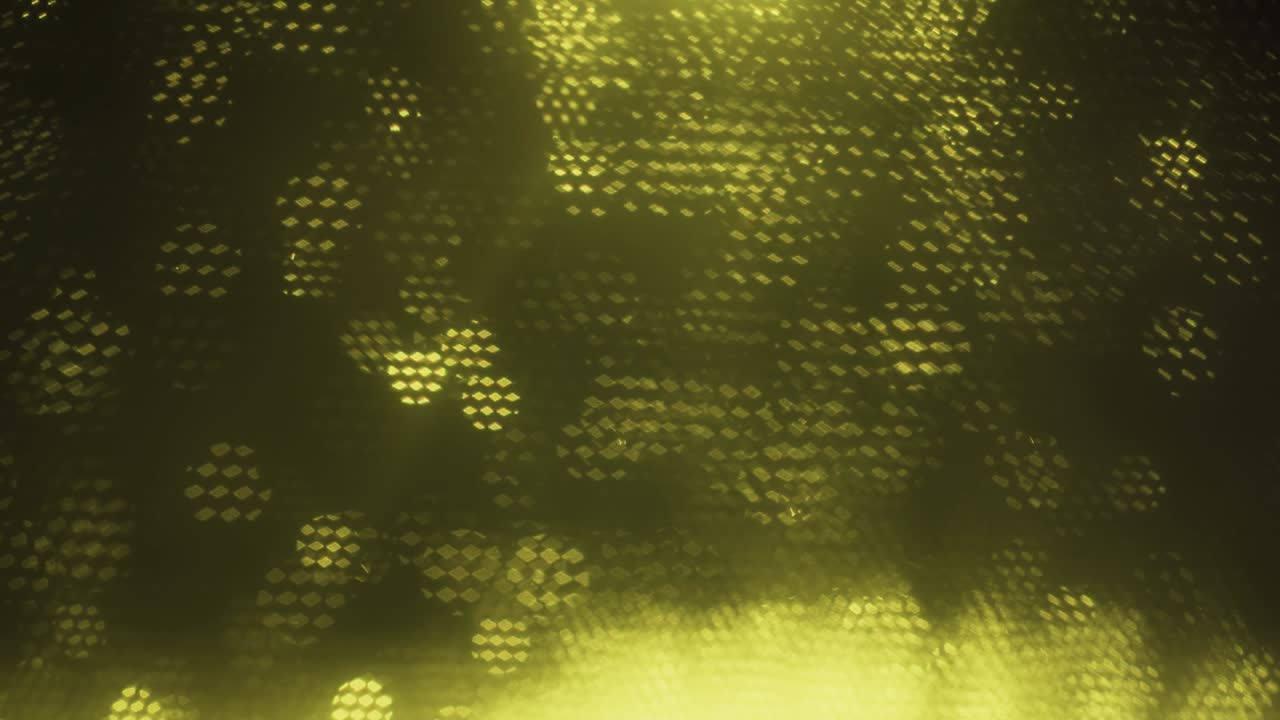 fondo borroso óptico abstracto amarillo. bokeh óptico superpuesto por panales en movimiento.