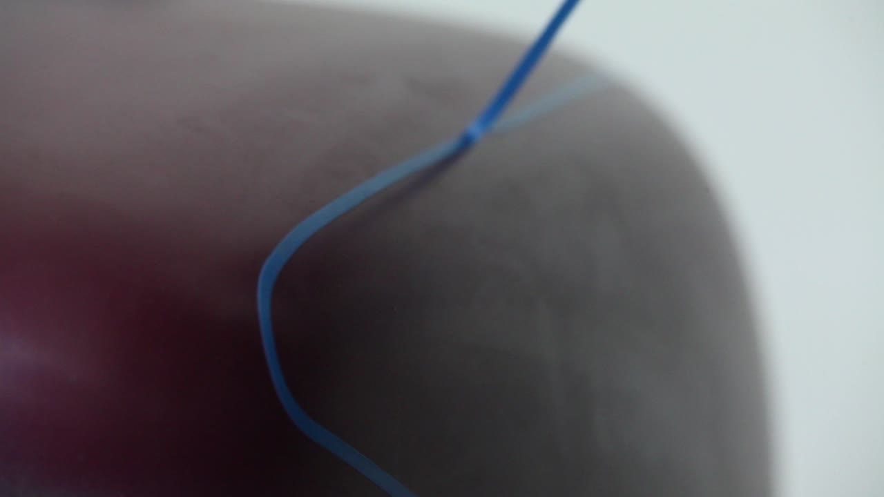 A man is making a custom painting for his motorcycles