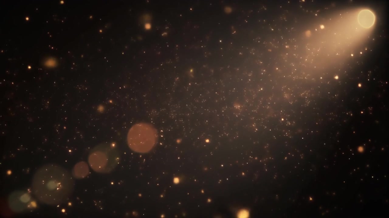 Golden Dust Particles Floating in Spotlight