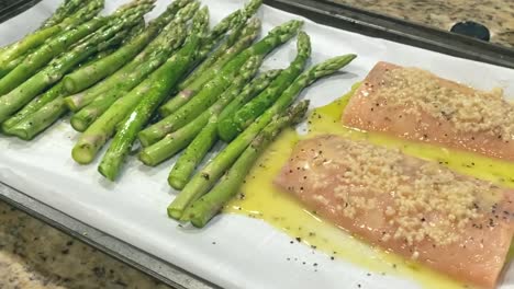 fresh salmon fillets and asparagus marinading, home cooking preparation