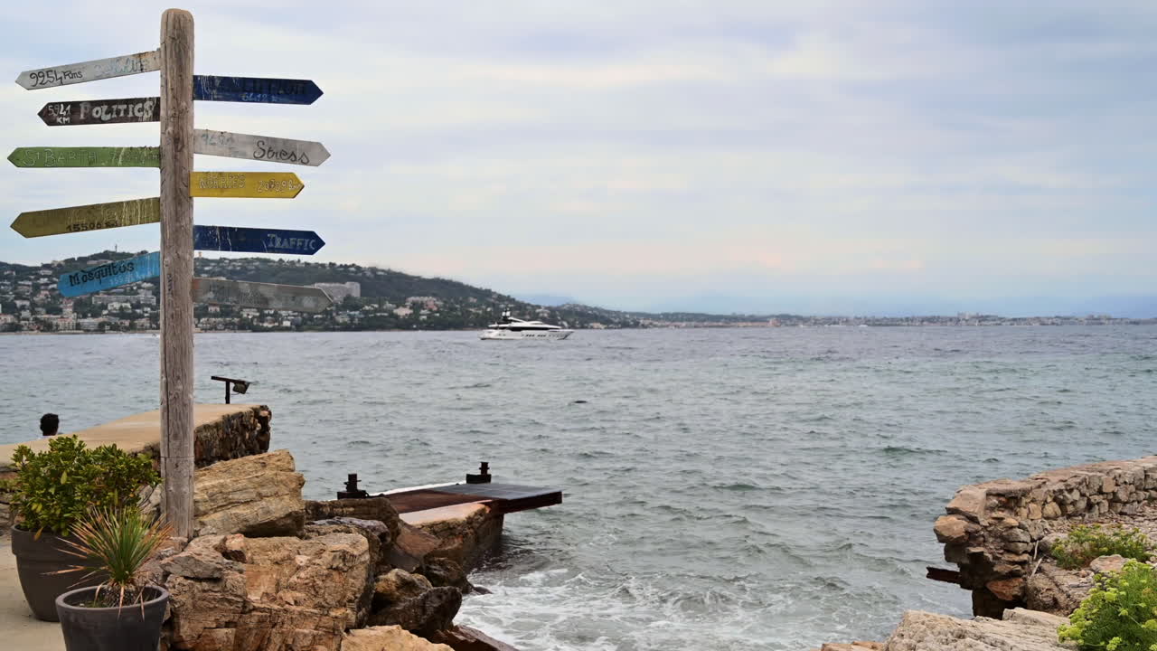 View of a milestone on the Island of Sainte-Marguerite, Cannes on the background, France