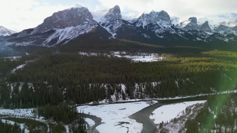 Aerial-view-of-Bow-river-and-mountains,-Canmore,-Alberta,-Canada