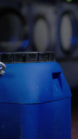 closeup of a blue plastic container of laundry detergent