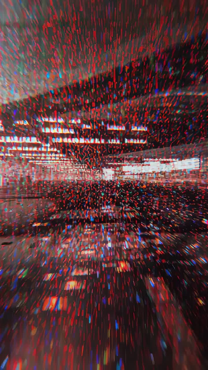 Vertical video: Starting camera moving past mid rail along shiny floor in terminal toward red light