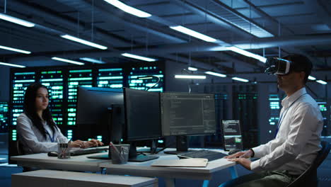 it worker doing maintenance on server farm gear using virtual reality technology