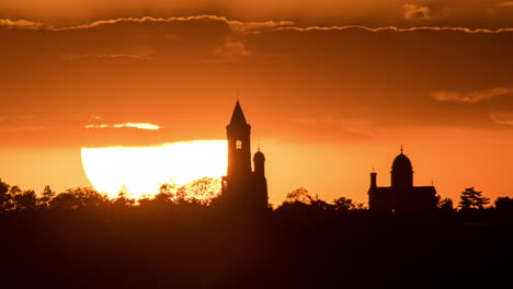 silhouette of buildings at sunset