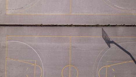 4k drone overhead clip over a basketball court in a sports complex in thessaloniki, greece