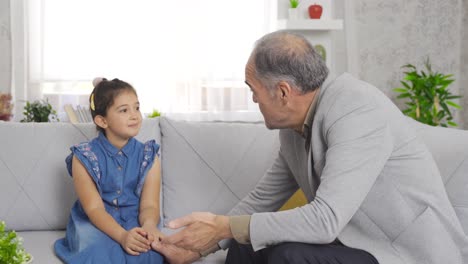 Grandfather-gives-advice-to-his-granddaughter.-Grandpa-and-grandson.