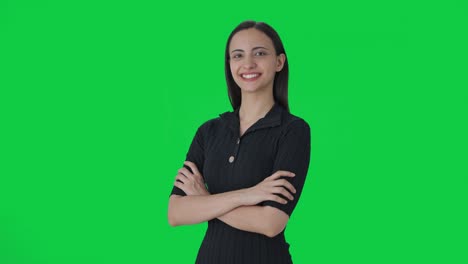 Portrait-of-Happy-Indian-female-journalist-standing-crossed-hands-Green-screen