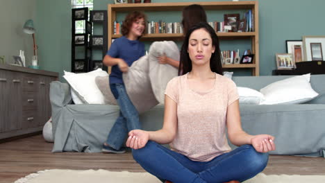 mother trying to relax while children playing