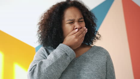 young woman yawning and neutral expression