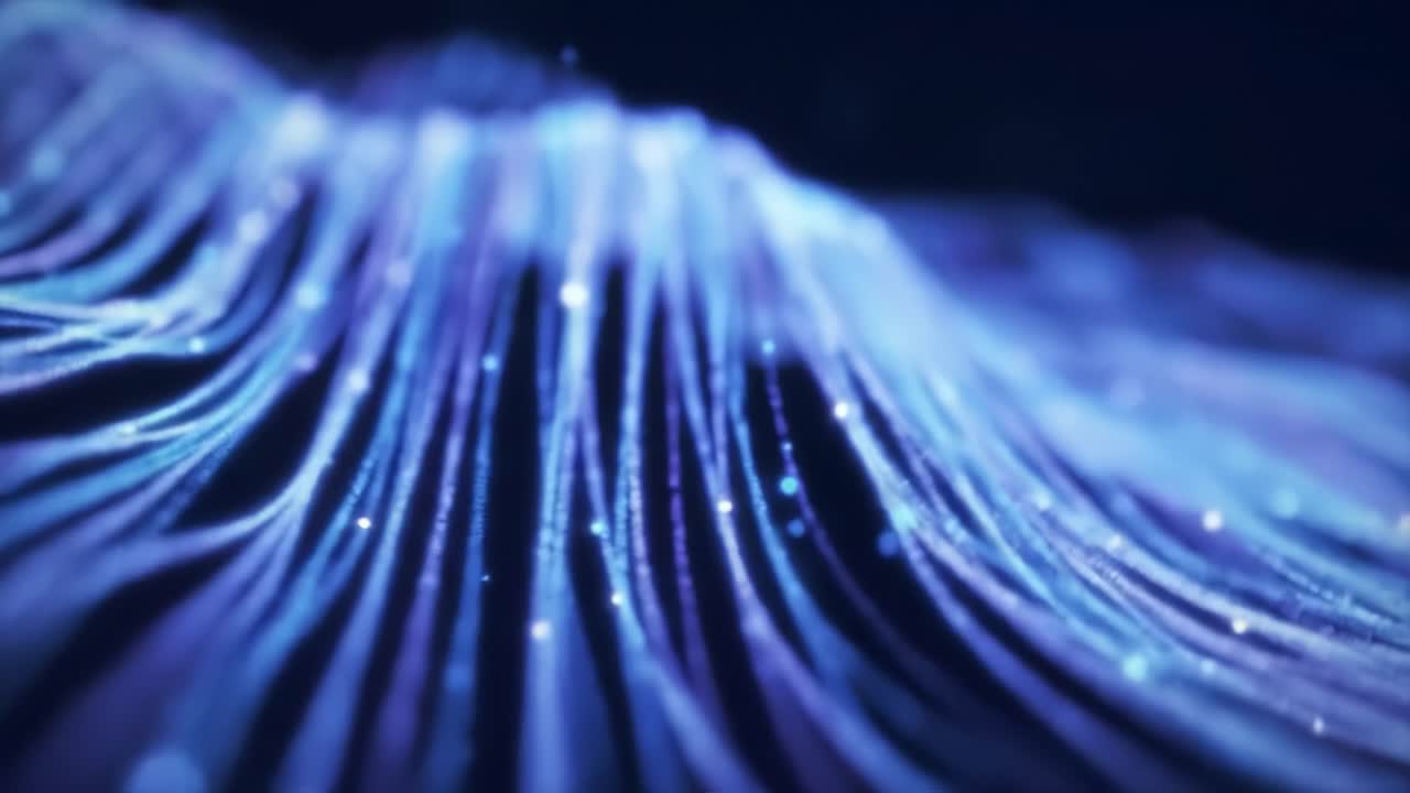 Glowing lines flow seamlessly, creating enchanting patterns. Soft blue hues dance in rhythmic motion, evoking a sense of calm. The visual display captivates with its dynamic energy and tranquility.