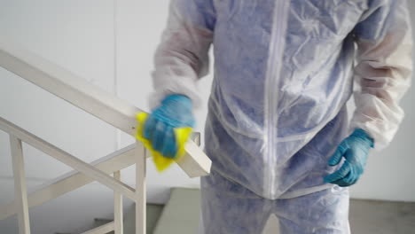 cleaning a staircase with protective gear