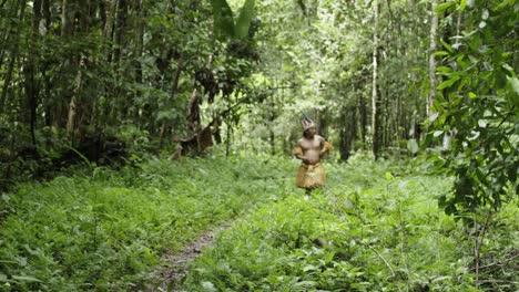 Native-guy-walk-on-a-trail-in-the-dense-forest-in-Leticia,-Amazon,-Colombia