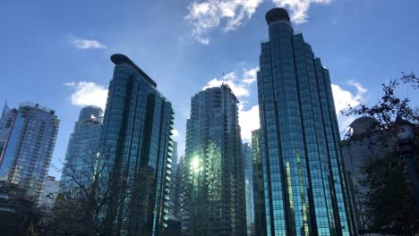 skyline of downtown vancouver the multiple glass skyscrapers on a sunny partly cloudy winter day