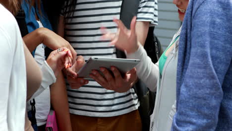 friends using and touching tablet pc together