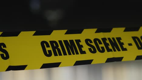 intermittent flash light illuminates police crime scene reflective tape