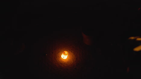 foundry scene with molten metal pouring into mold in a dark environment