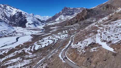 snowy mountain valley road