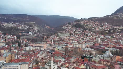 sarajevo city in dinaric alps, capital of bosnia and herzegovina, 4k aerial view