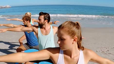 group of people performing yoga