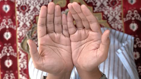 religious muslim young man praying , high angle view