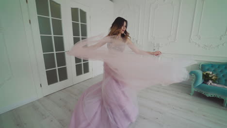 Classical young gourgeous bride. View of young smiling bride dancing in studio room