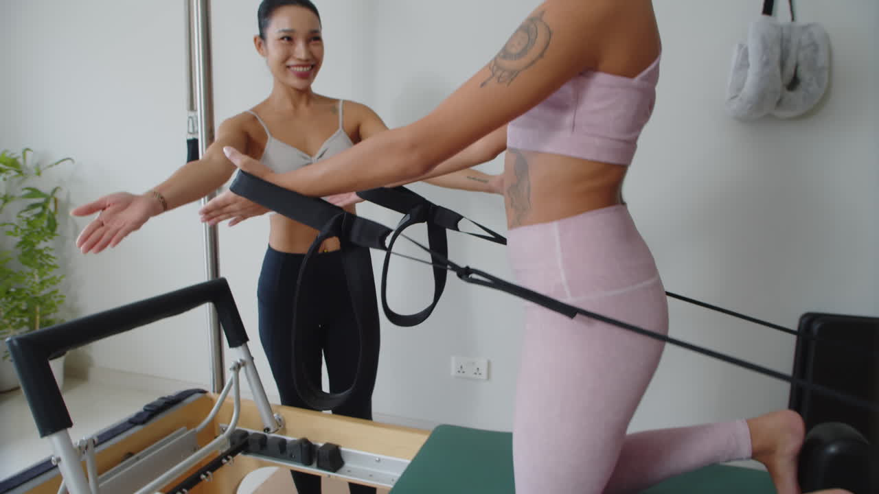 Female Athlete Performing Arm Stretching Exercises with Fitness Coach