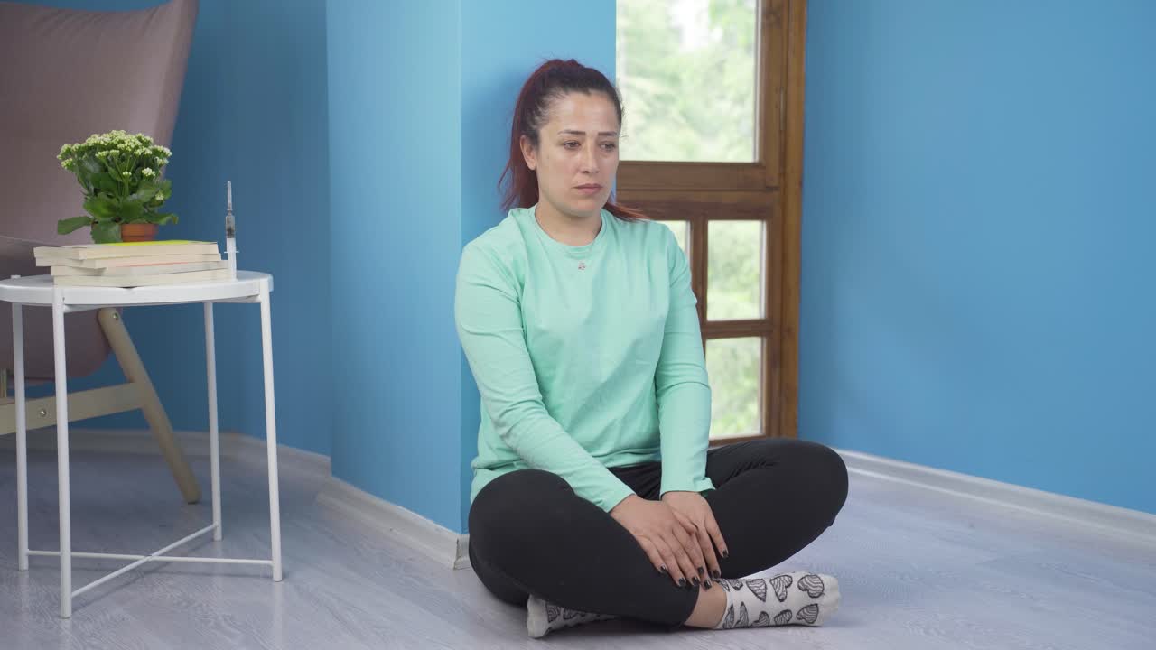 The woman who committed suicide with a syringe.