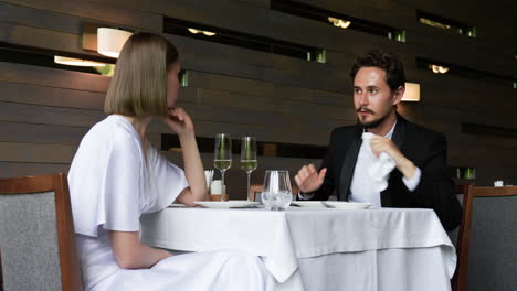 young people talking at elegant restaurant