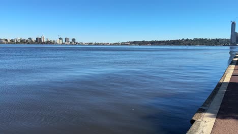 looking down the footpath of riverside drive across the swan river to elizabeth quay, kings park and south perth foreshore