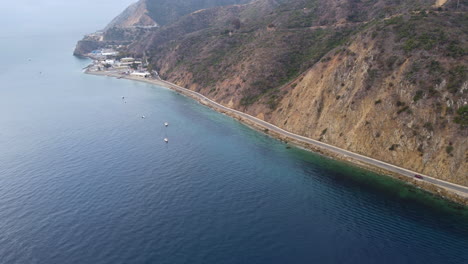 aerial view of santa catalina island rocky coastline highway and deep blue ocean, established shot