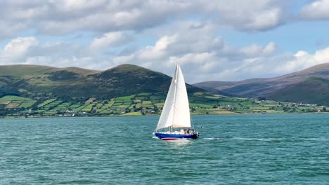 Sailboat-Adventure:-Handheld-Tracking-on-a-Sunny-Day-with-Stunning-Views-of-the-Mourne-Mountains-and-Coastal-Scenery