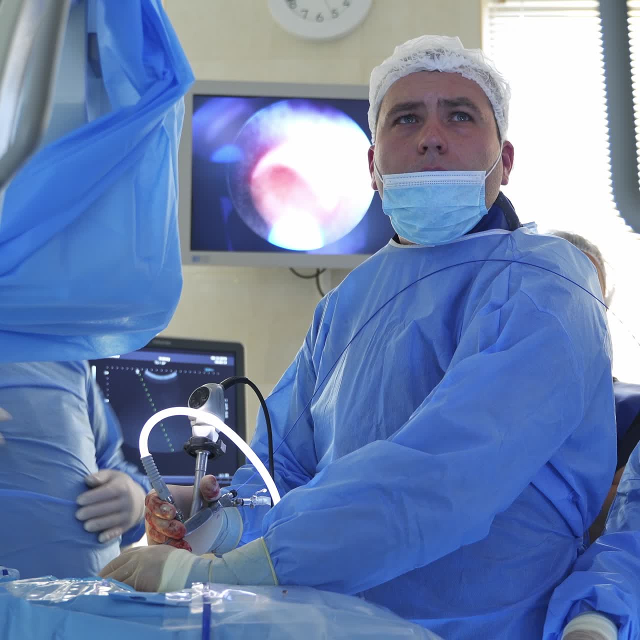 Surgeons working in operating room. Group of surgeons in operating room with surgery equipment