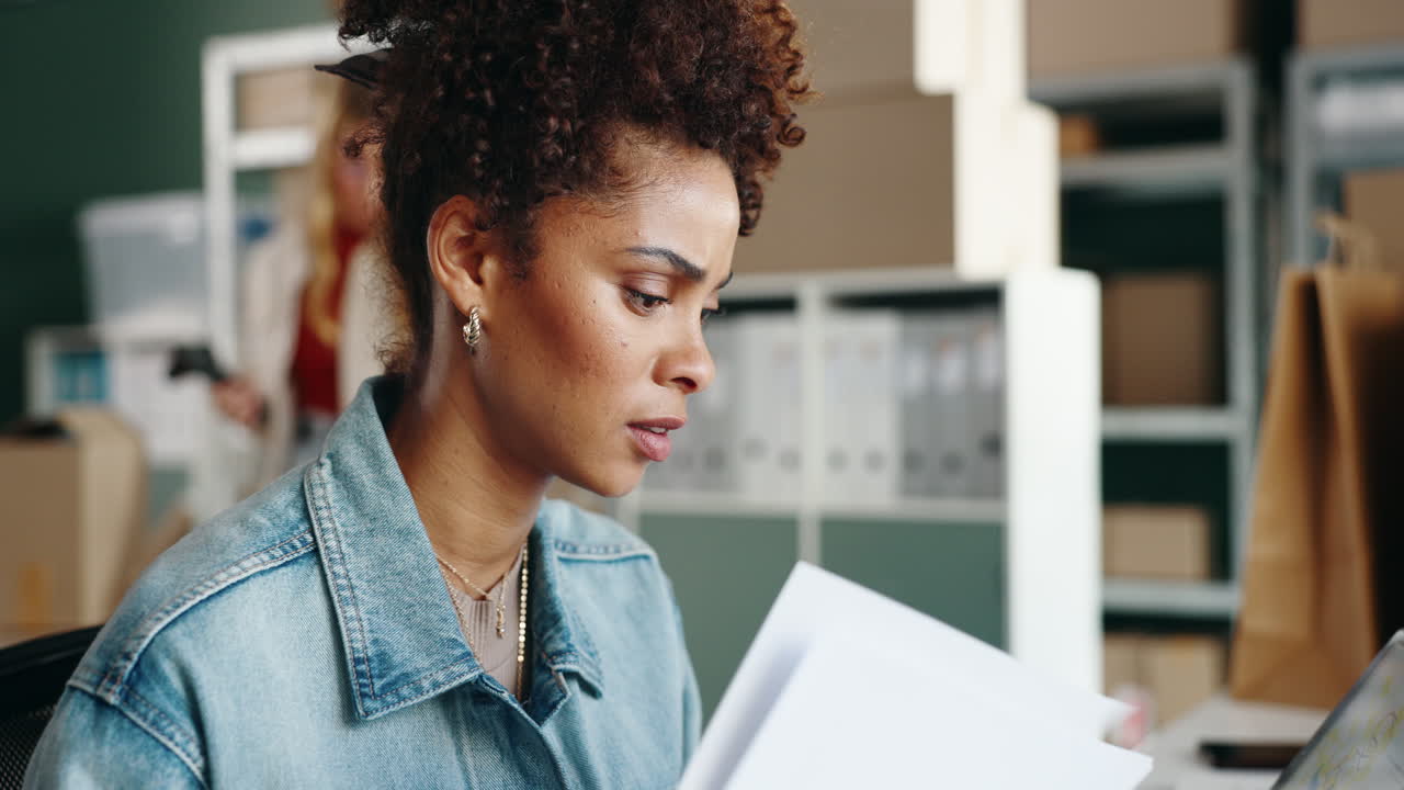 Woman working with documents in office
