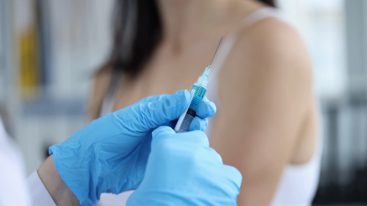 Syringe with vaccine in hand rejection gesture