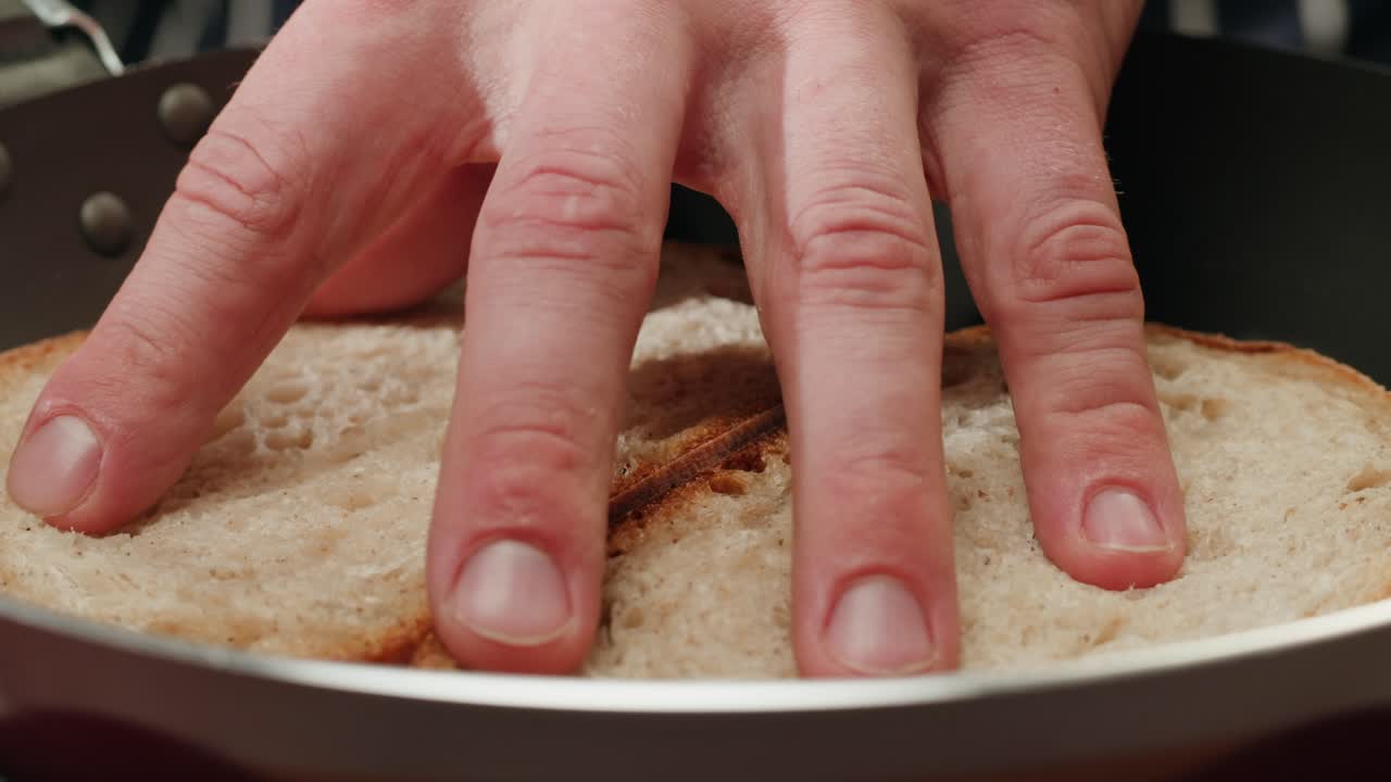 Toasting bread slices in a pan
