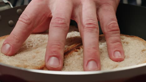 toasting bread slices in a pan