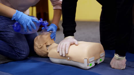 training practice on a dummy. students study doing resuscitation technique on a mannequin to save life. cardiopulmonary resuscitation.