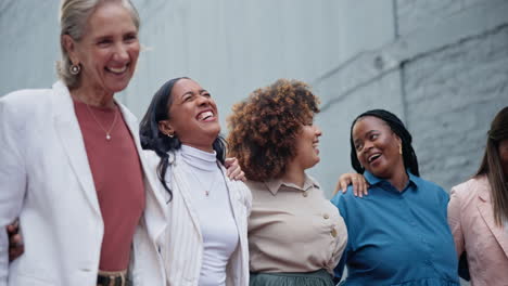 Team,-hug-and-business-women-in-city