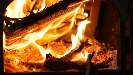 close up of fire burning in traditional fireplace in slow motion