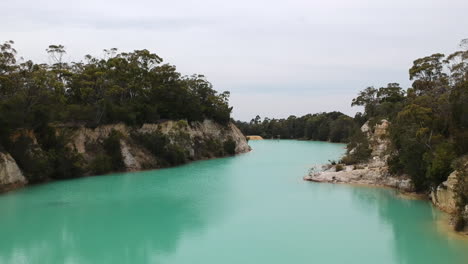 Aerial-of-Little-Blue-Lake-in-Mount-Cameron,-Tasmania,-Australia