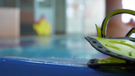 children's swimming lesson in indoor pool