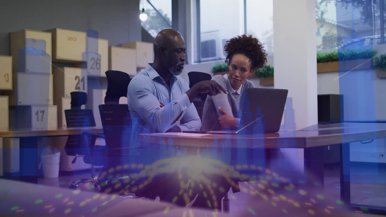 Collaborating at desk, business professionals using animation for digital data visualization