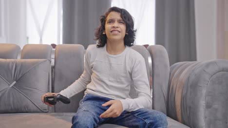 competitive indian teenager boy playing video games